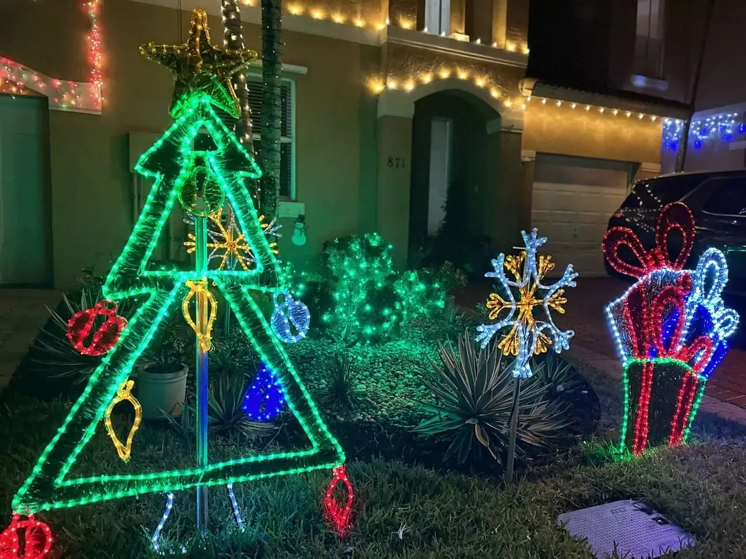 Rope-light Christmas tree and gift-box yard decorations